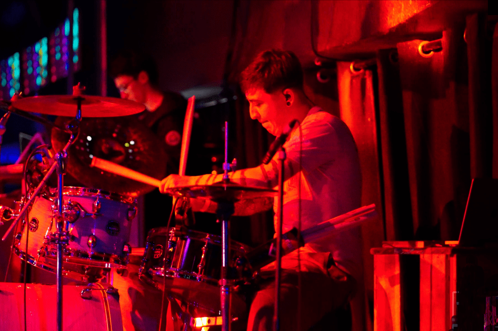 Session musician playing drums in music recording studio