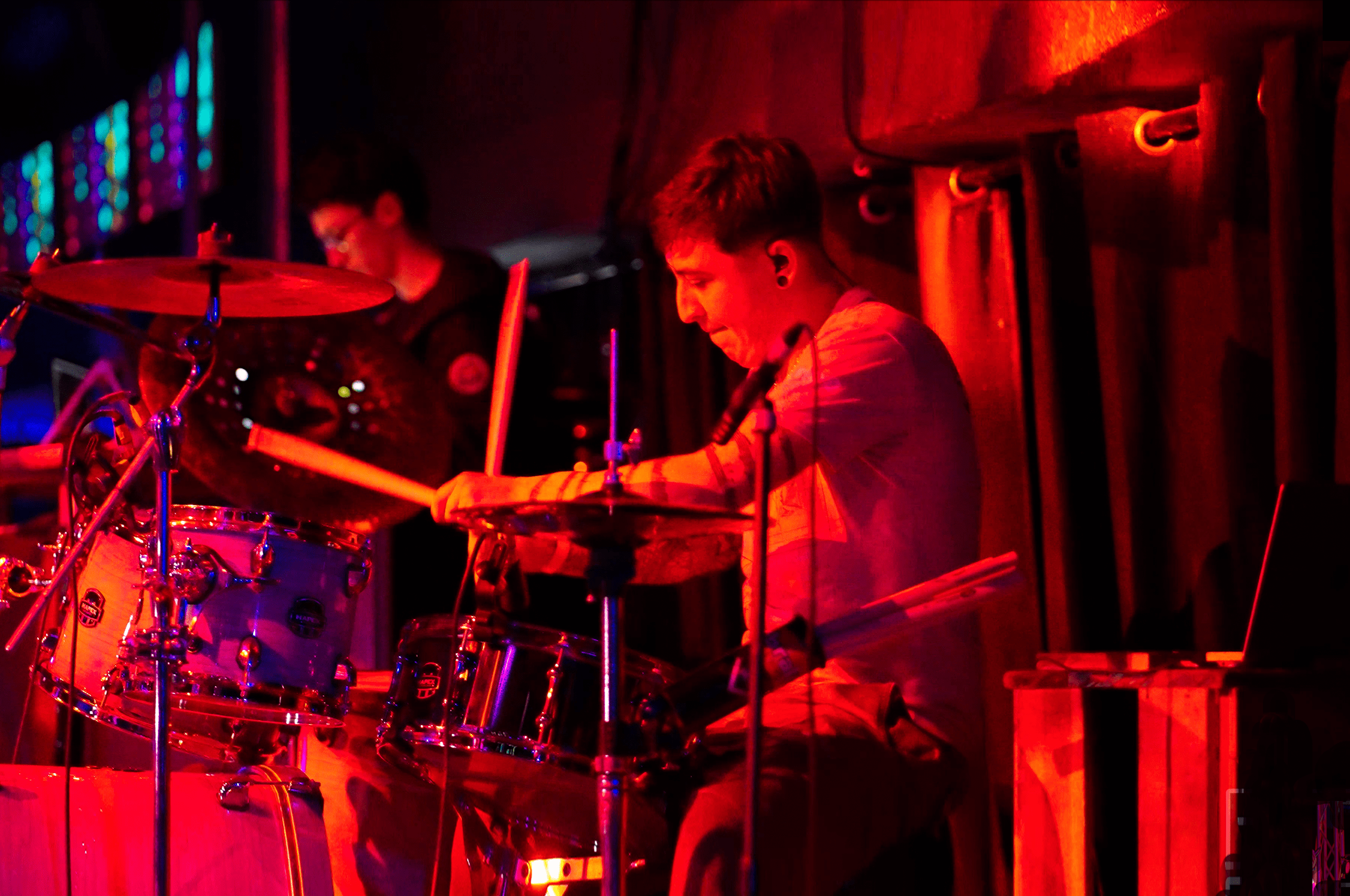 Session musician playing drums in music recording studio