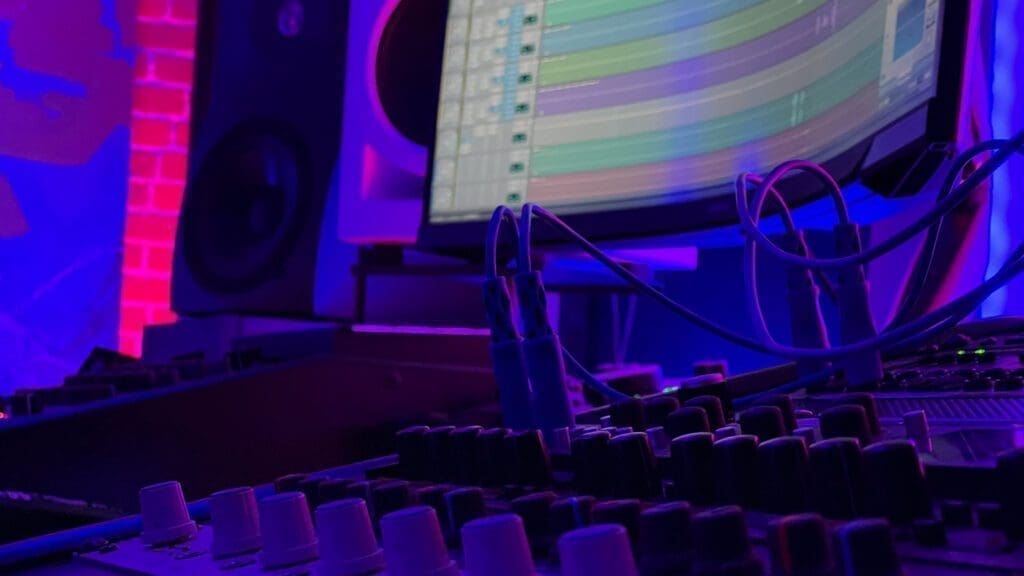 Analog mixing gear with ProTools editing in background