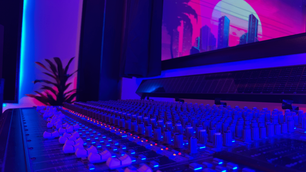 Pro mixing board with city image in background