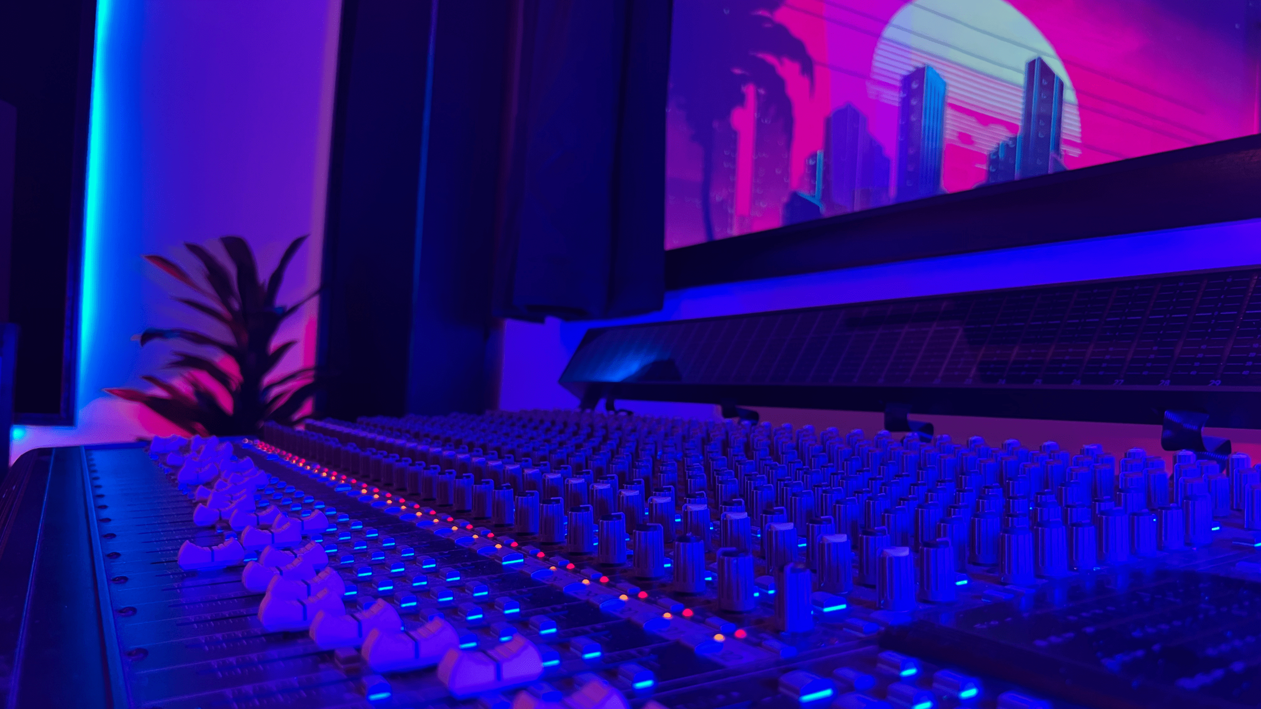 Pro mixing board with city image in background